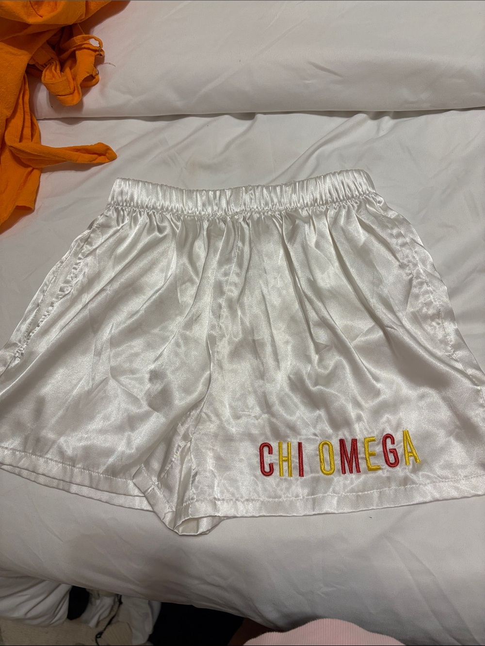 Chi Omega White Satin Athletic Shorts with Red and Gold Embroidery